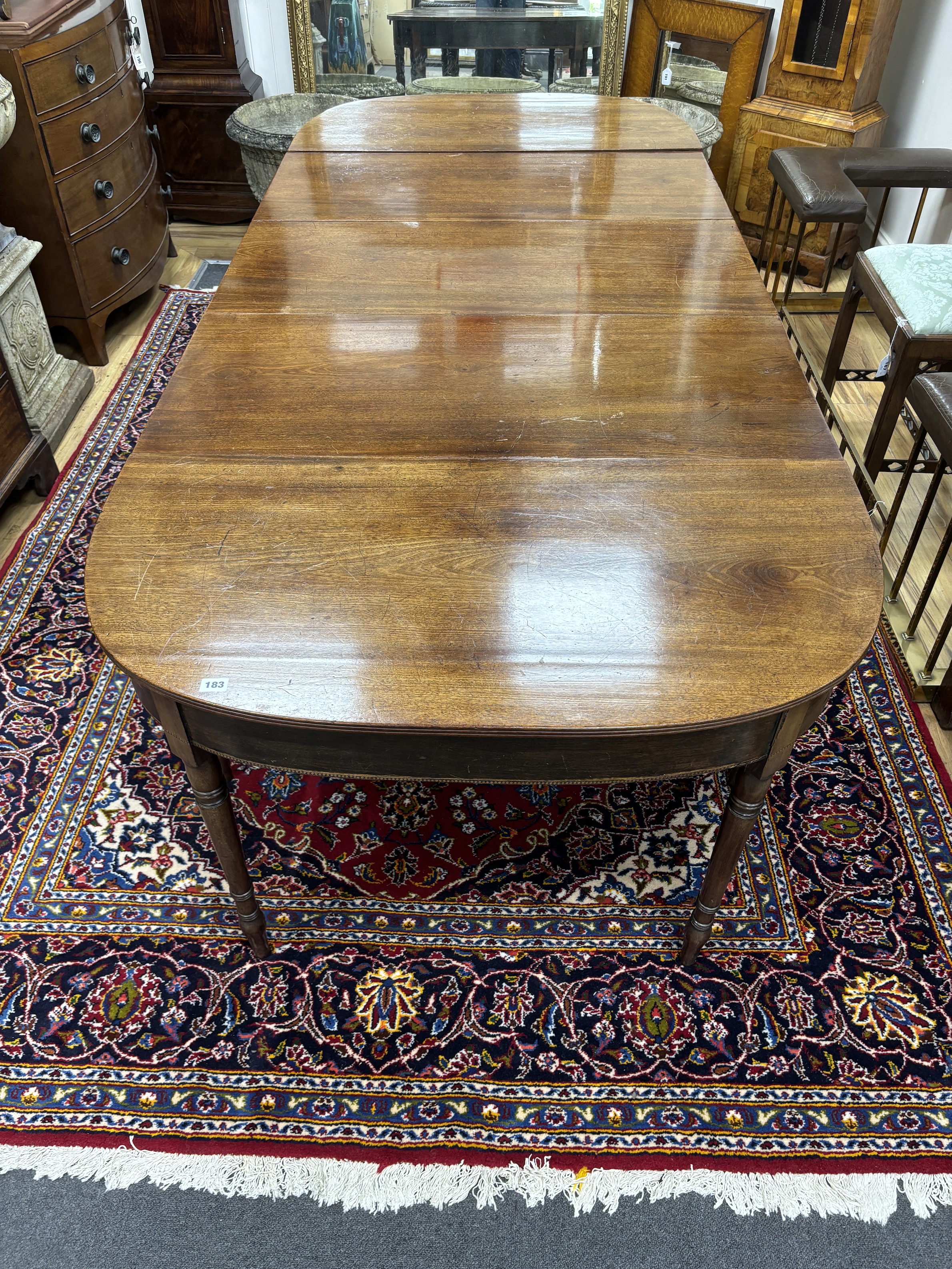 A Regency mahogany D end extending dining table, 257cm extended, width 109cm, height 70cm